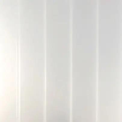 Close-up of ribbed, Heatstop Pearl translucent sunroom roofing material with a bright white reflective finish.